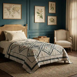 Framed Botanicals Twin Quilt shown in a traditionally styled bedroom.
