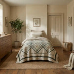 Framed Botanicals Twin Quilt shown in a simply decorated bedroom.