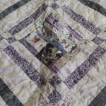 Detail shot of Gathered Correspondence Twin Quilt showing fabric and construction detail.