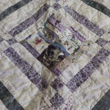 Detail shot of Gathered Correspondence Twin Quilt showing fabric and construction detail.