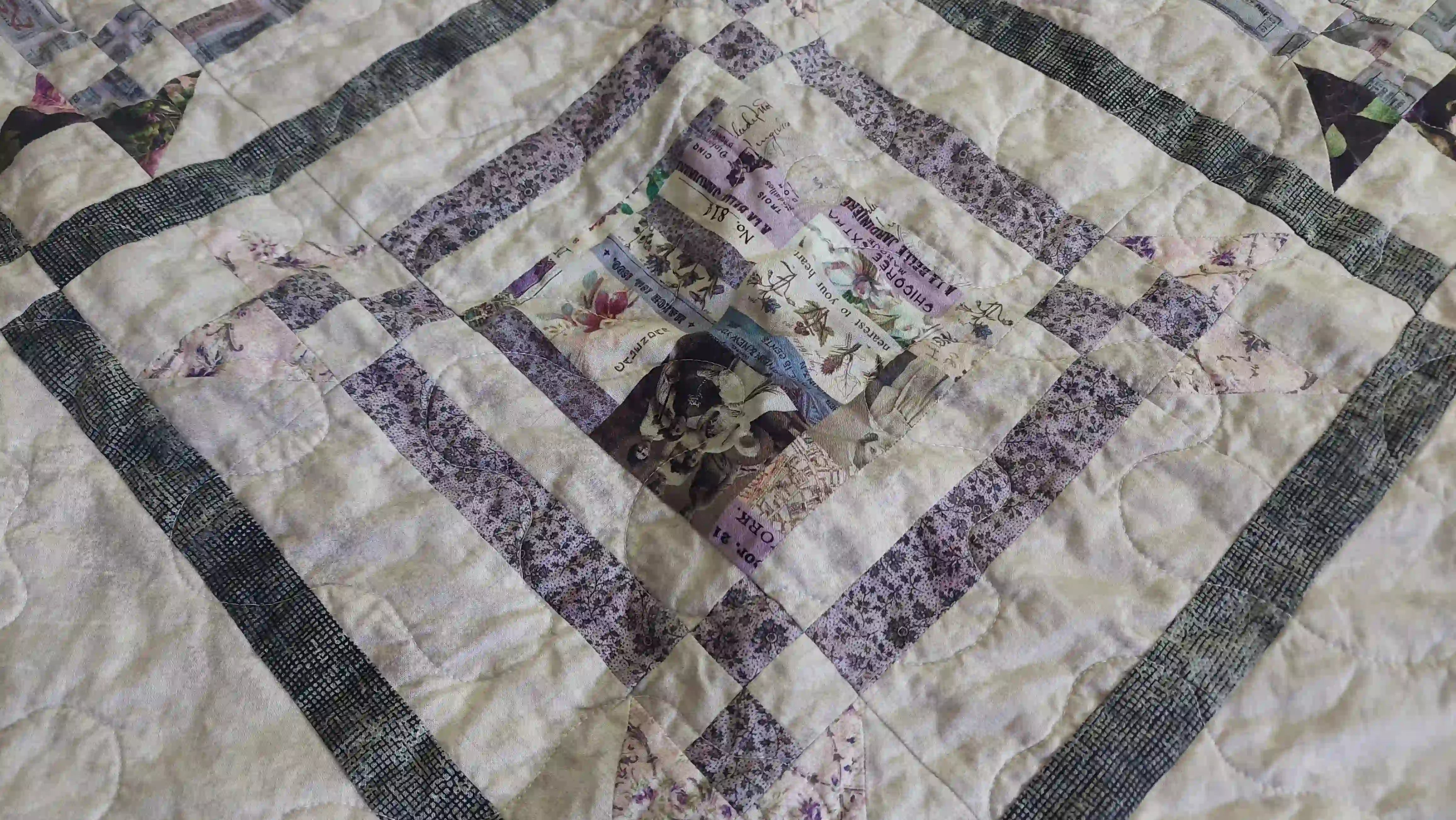 Detail shot of Gathered Correspondence Twin Quilt showing fabric and construction detail.