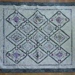 Flat lay of Gathered Correspondence Twin Quilt showing entire quilt.