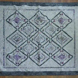 Flat lay of Gathered Correspondence Twin Quilt showing entire quilt.