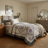 Gathered Correspondence Twin Quilt shown in elegantly simple bedroom.