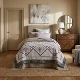 Gathered Correspondence Twin Quilt shown in simple but elegant bedroom.