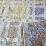 Georgian Garden Queen with corner flipped over to show backing along with quilt stitching detail
