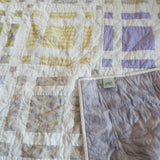 Georgian Garden Queen with corner flipped over to show backing along with quilt stitching detail
