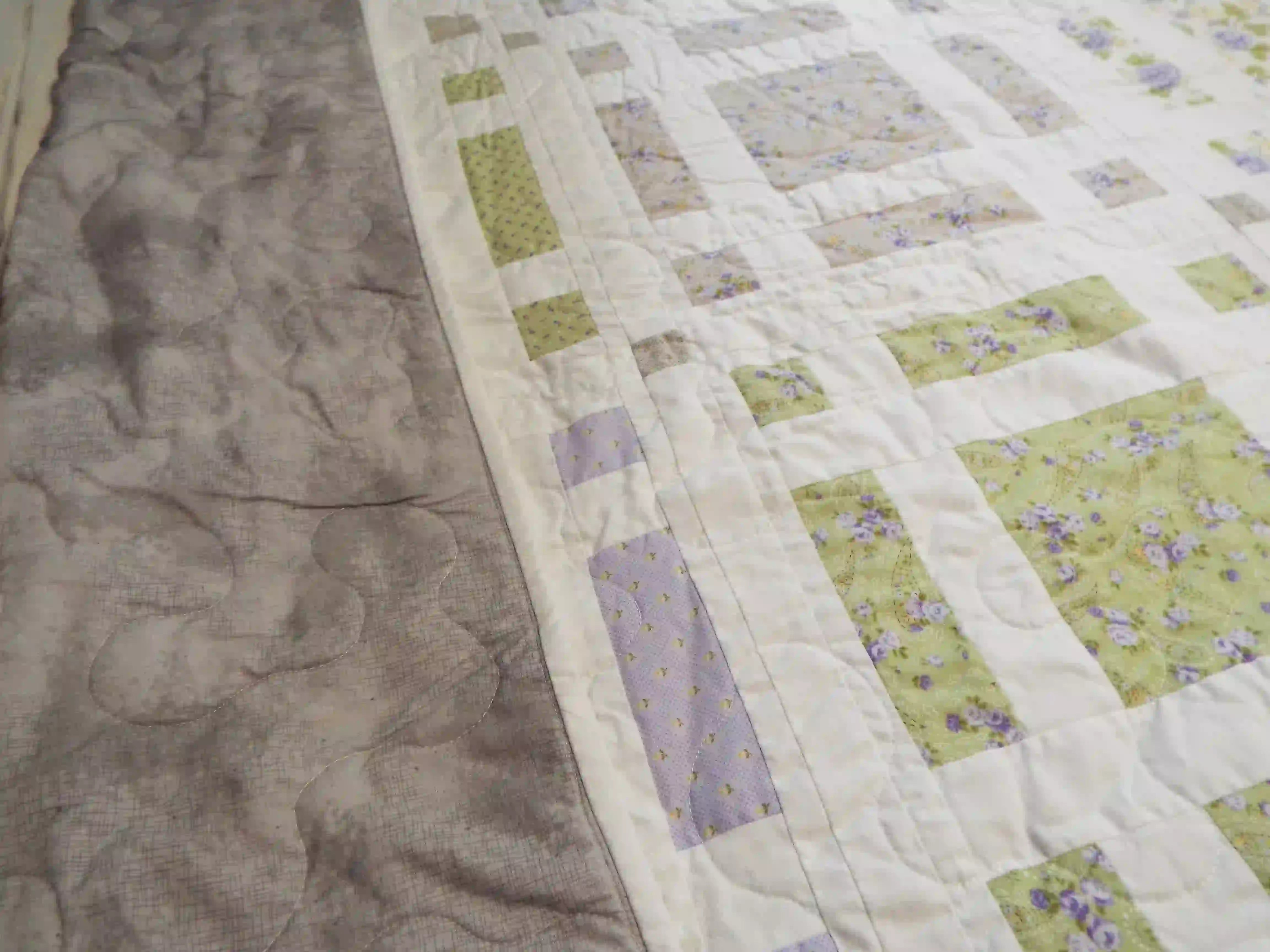 Georgian Garden Queen with top folded over to show backing, binding, and stitching