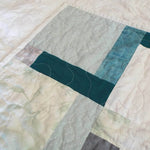 Detail of handmade quilt showing both top and backing