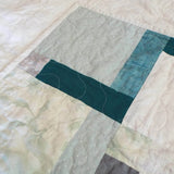 Detail of handmade quilt showing both top and backing