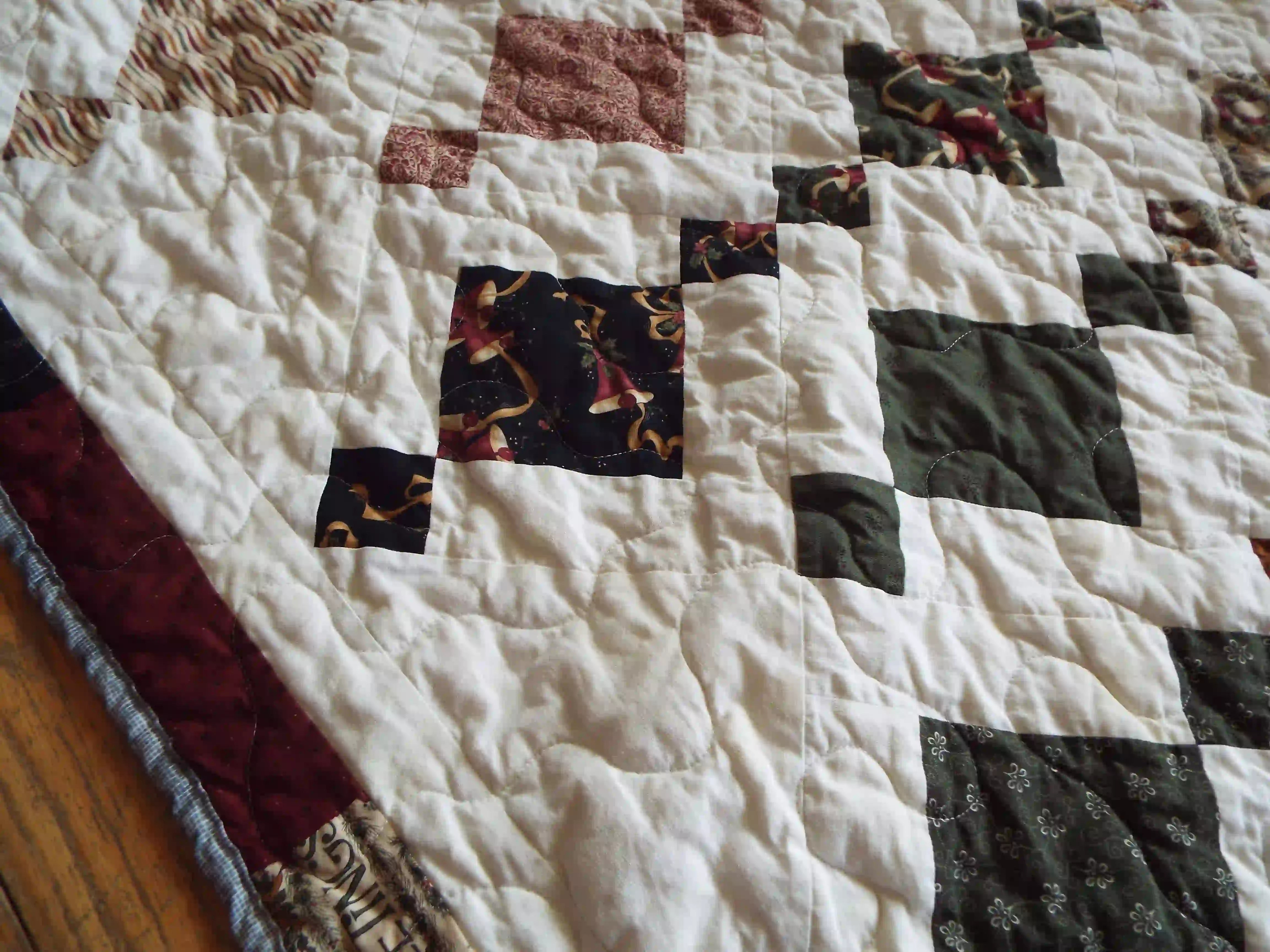 Holiday Heirloom quilt close up of fabrics and stitching