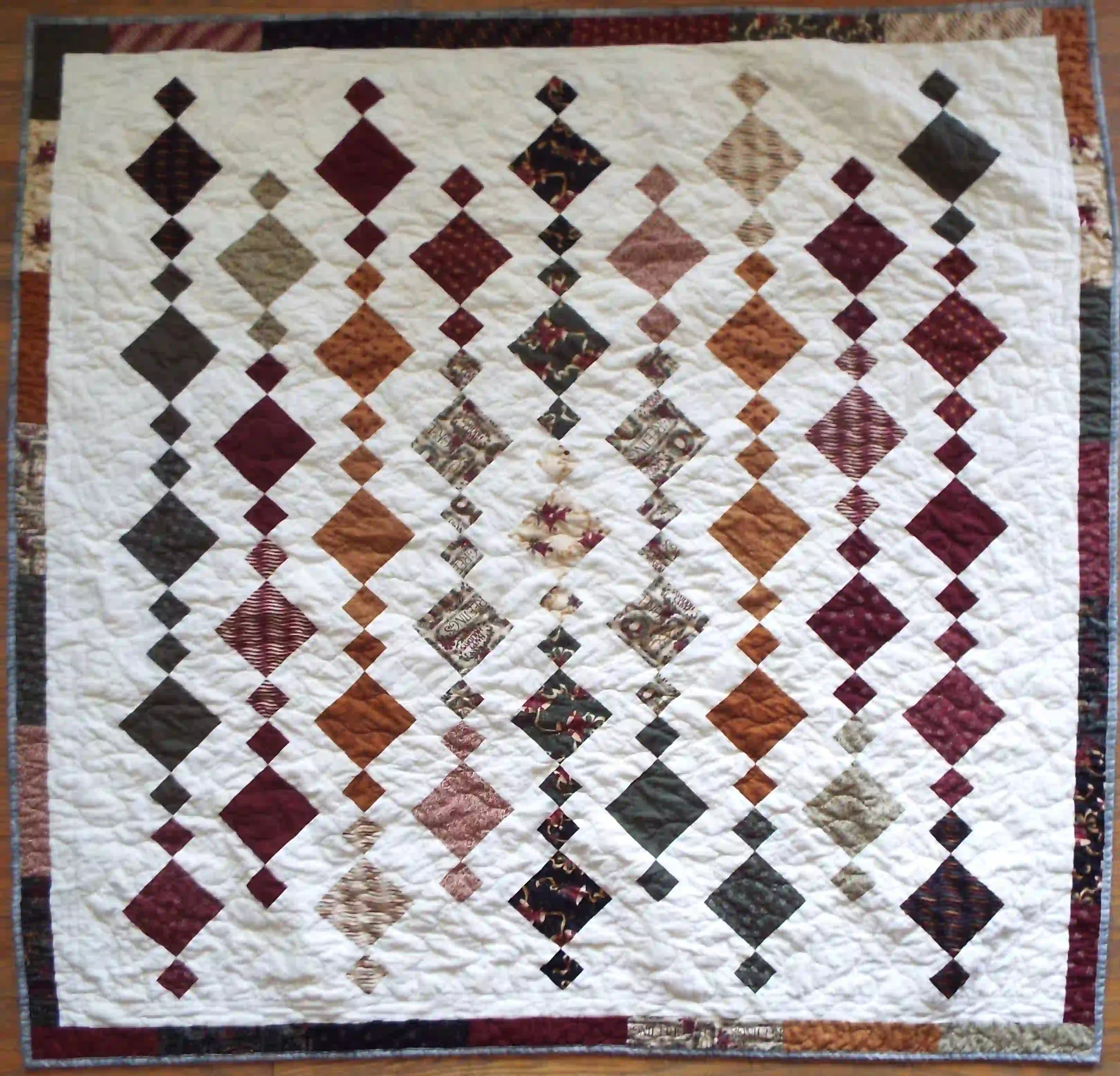 Holiday Heirloom lap quilt shown in its entirety in a flat lay