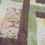 Detail of stitching and fabrics for Honeyed Tails Baby Quilt