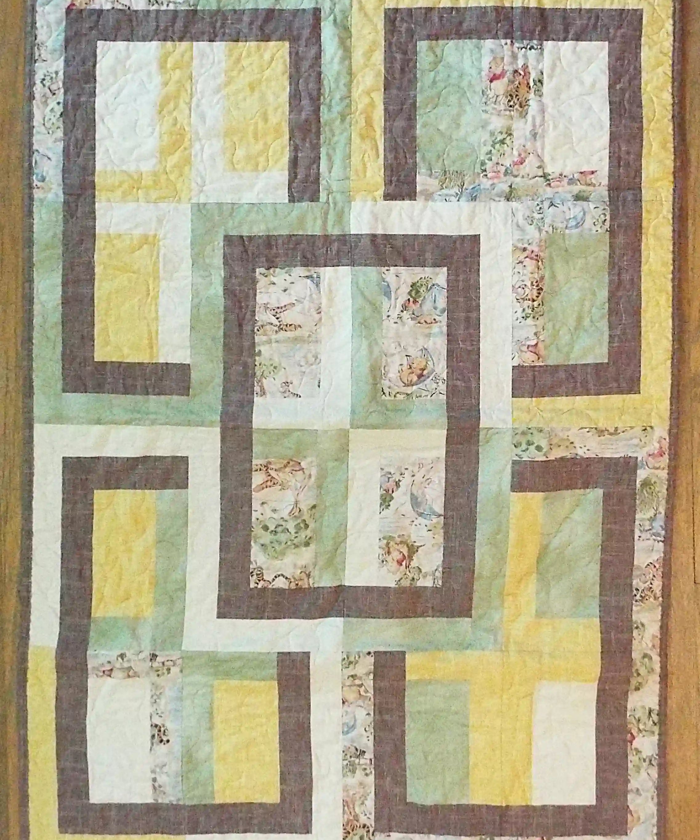 Flat lay of Honeyed Tails Baby Quilt showing entire quilt.