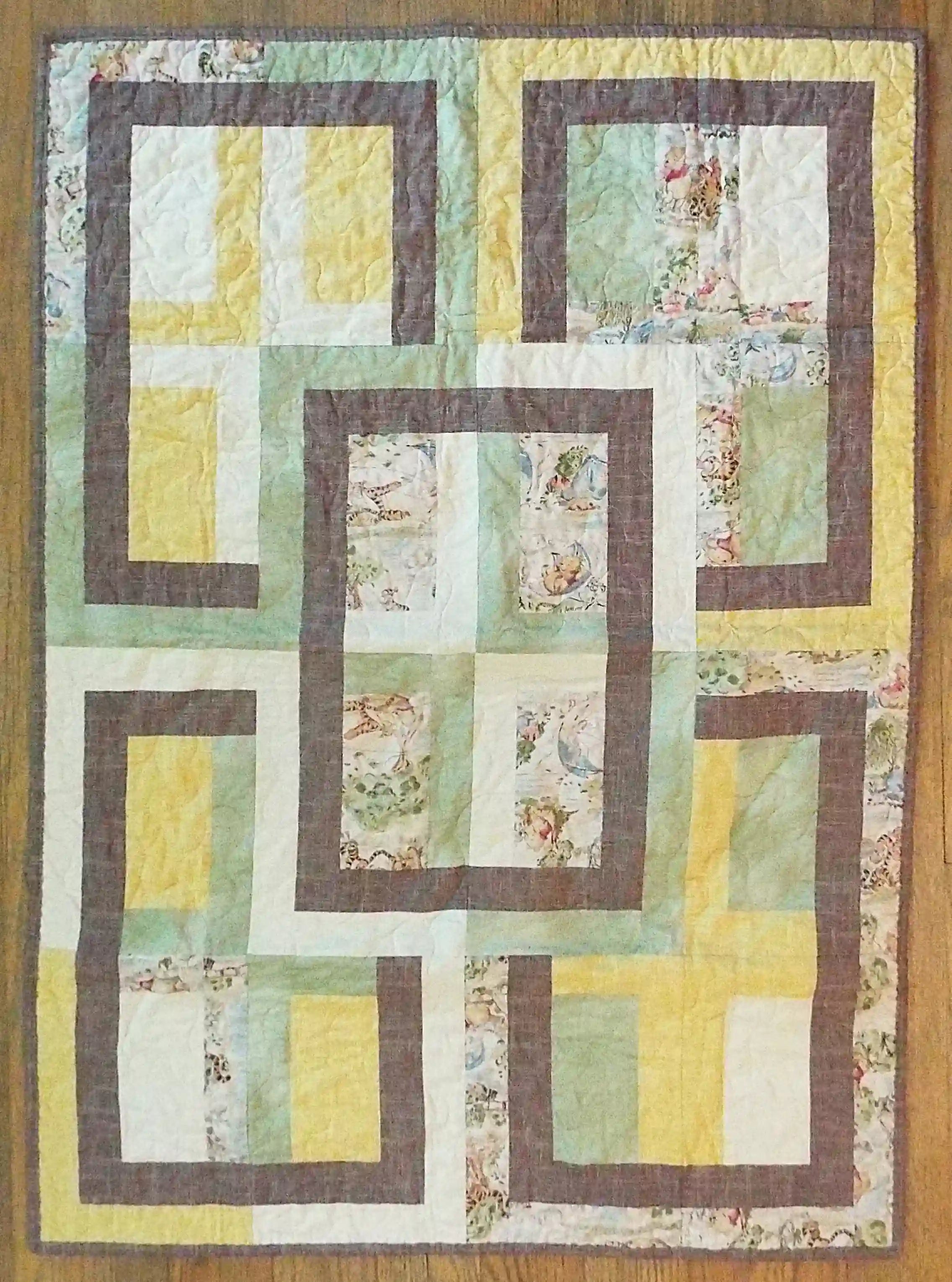 Flat lay of Honeyed Tails Baby Quilt showing entire quilt.