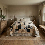 Inkstone King quilt shown in a contemporary country inspired bedroom with neutral walls.