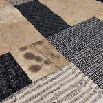 Close up of Inkstone King quilt showing fabrics and stitching detail.