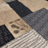 Close up of Inkstone King quilt showing fabrics and stitching detail.