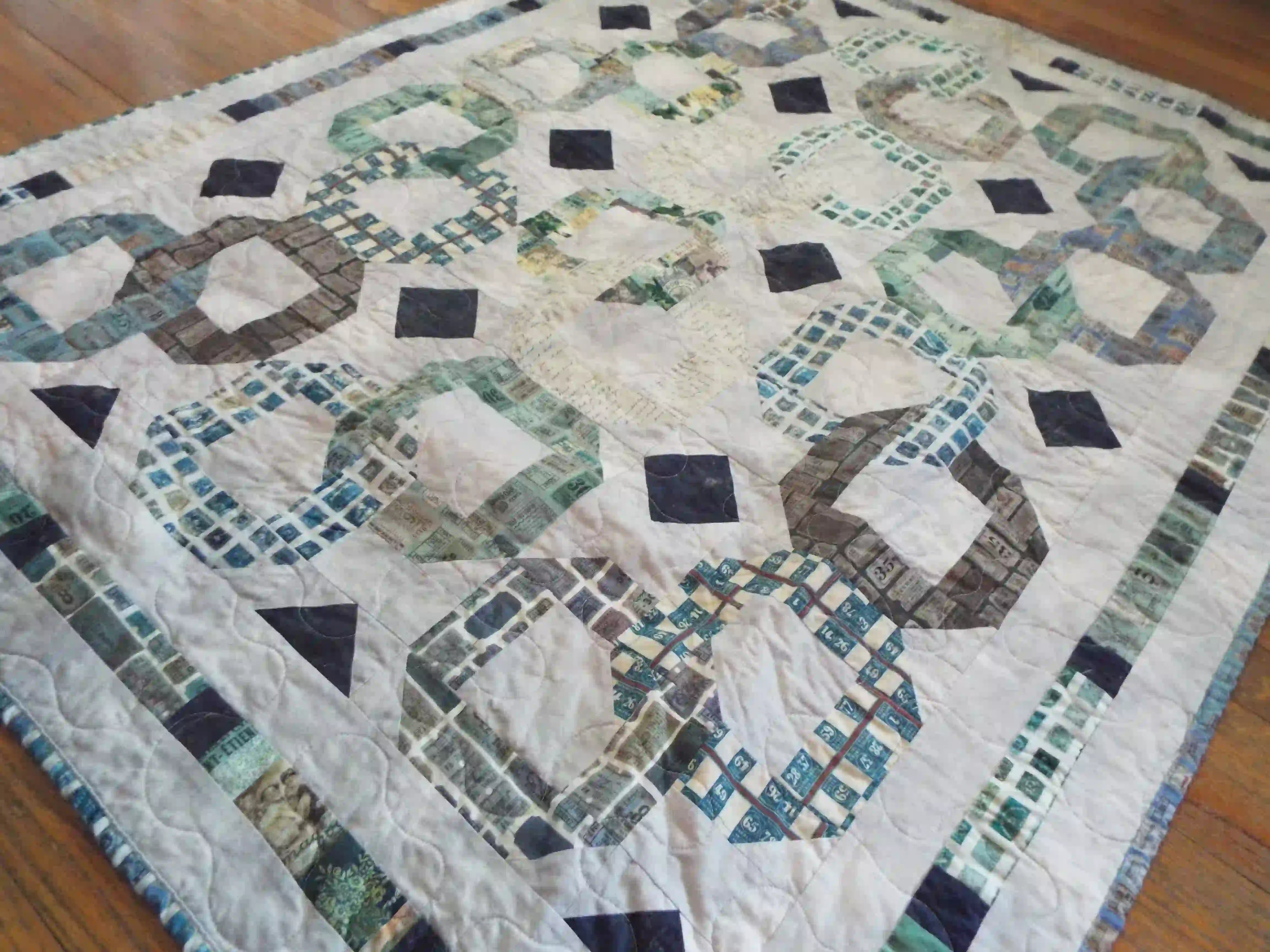 Angled lay of Links to the Past Lap Quilt showing the entire quilt.