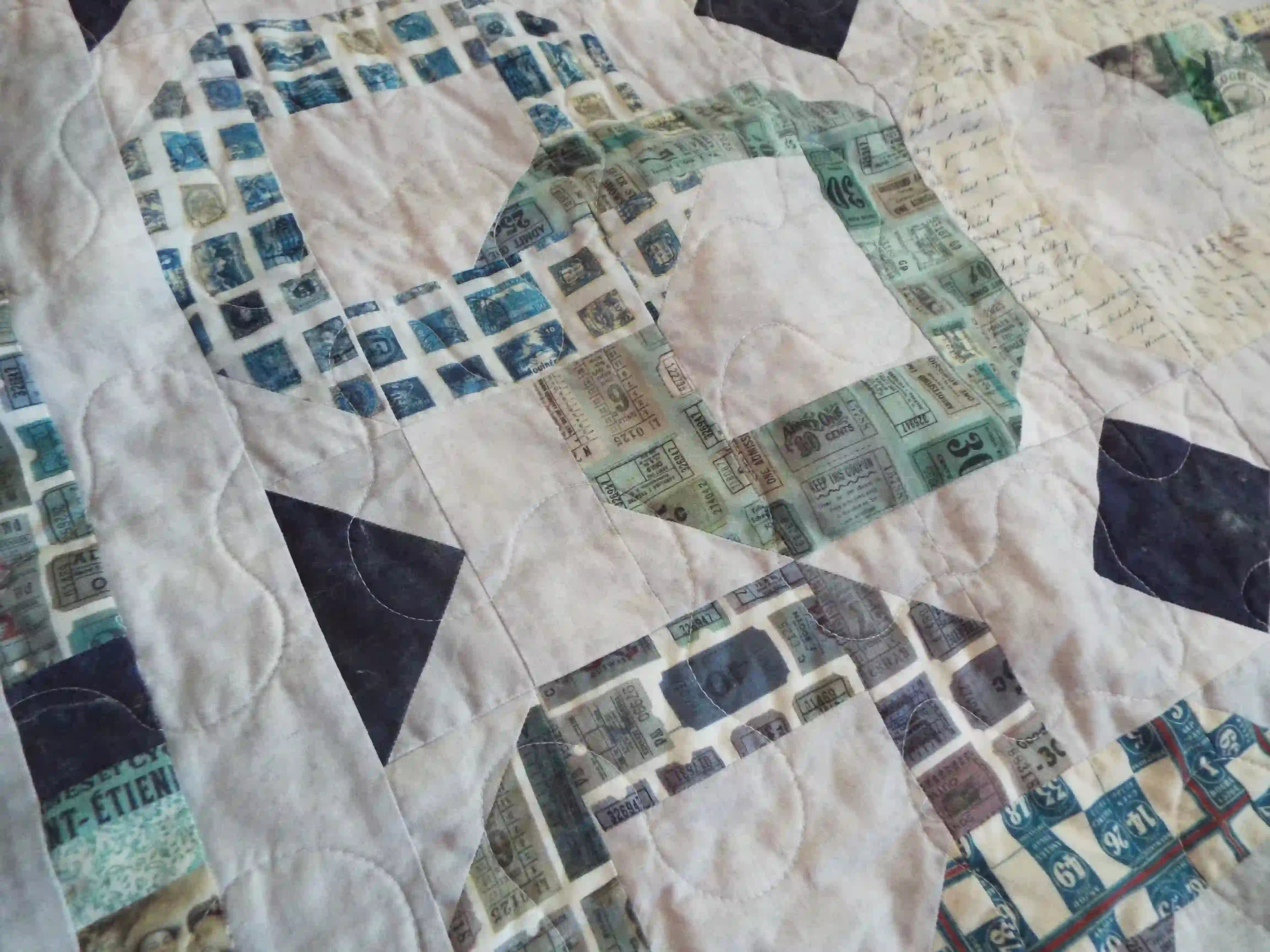 Detail of stitching and fabrics for Links to the Past Lap Quilt.
