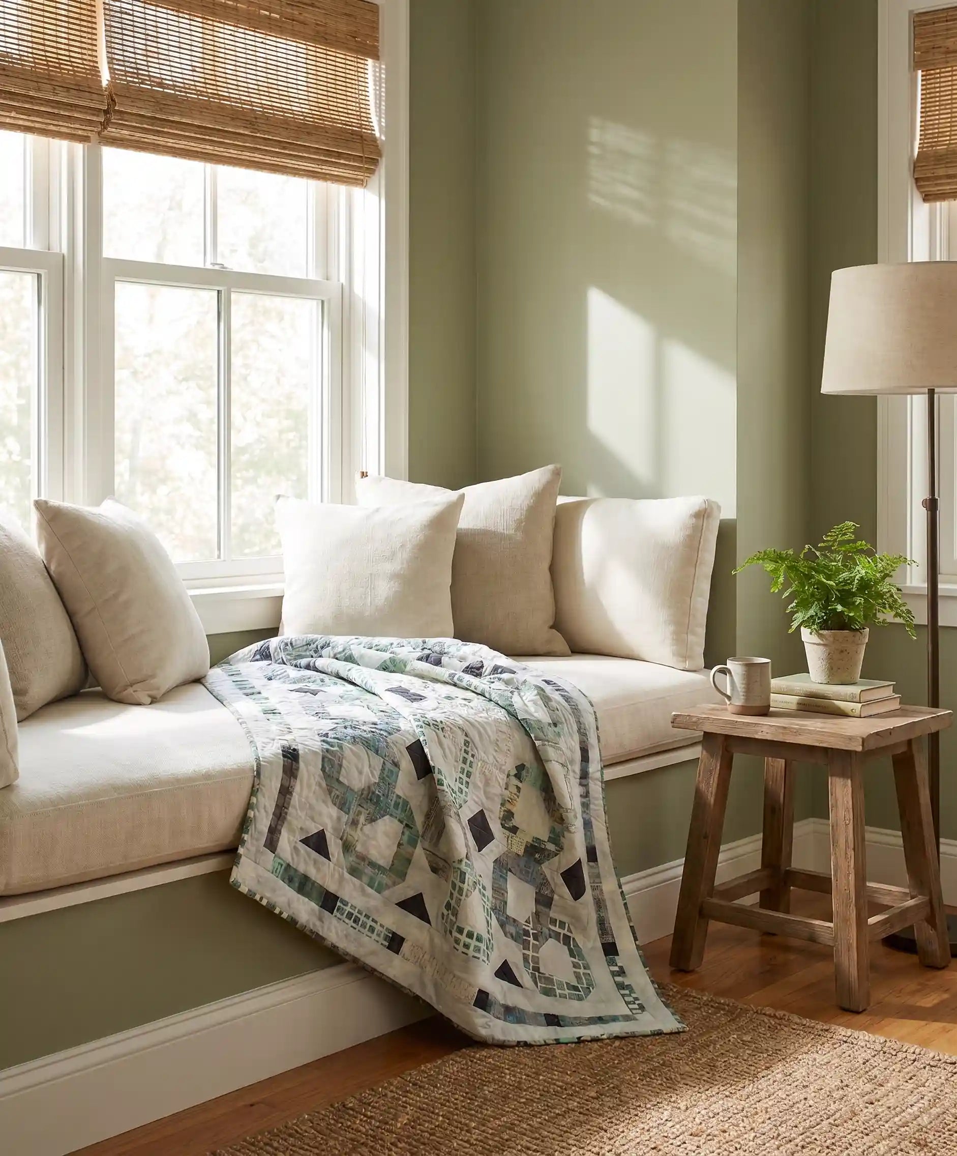 Links to the Past Lap Quilt shown in a minimally styled window seat corner.