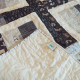 Corner flipped over on Little Framework Baby Quilt to show backing detail.