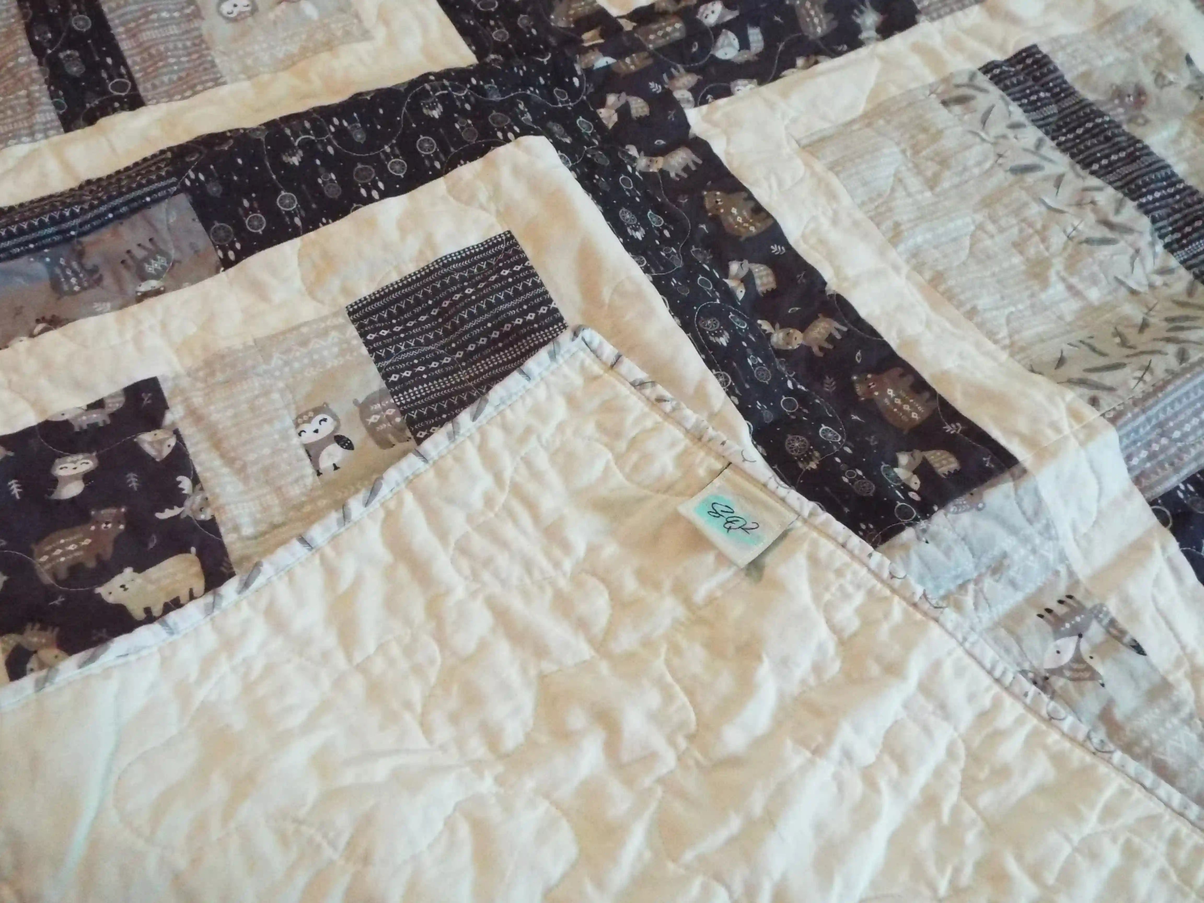 Corner flipped over on Little Framework Baby Quilt to show backing detail.