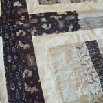Detail of Little Framework Baby Quilt showing quilt stitching.