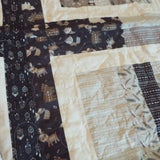 Detail of Little Framework Baby Quilt showing quilt stitching.