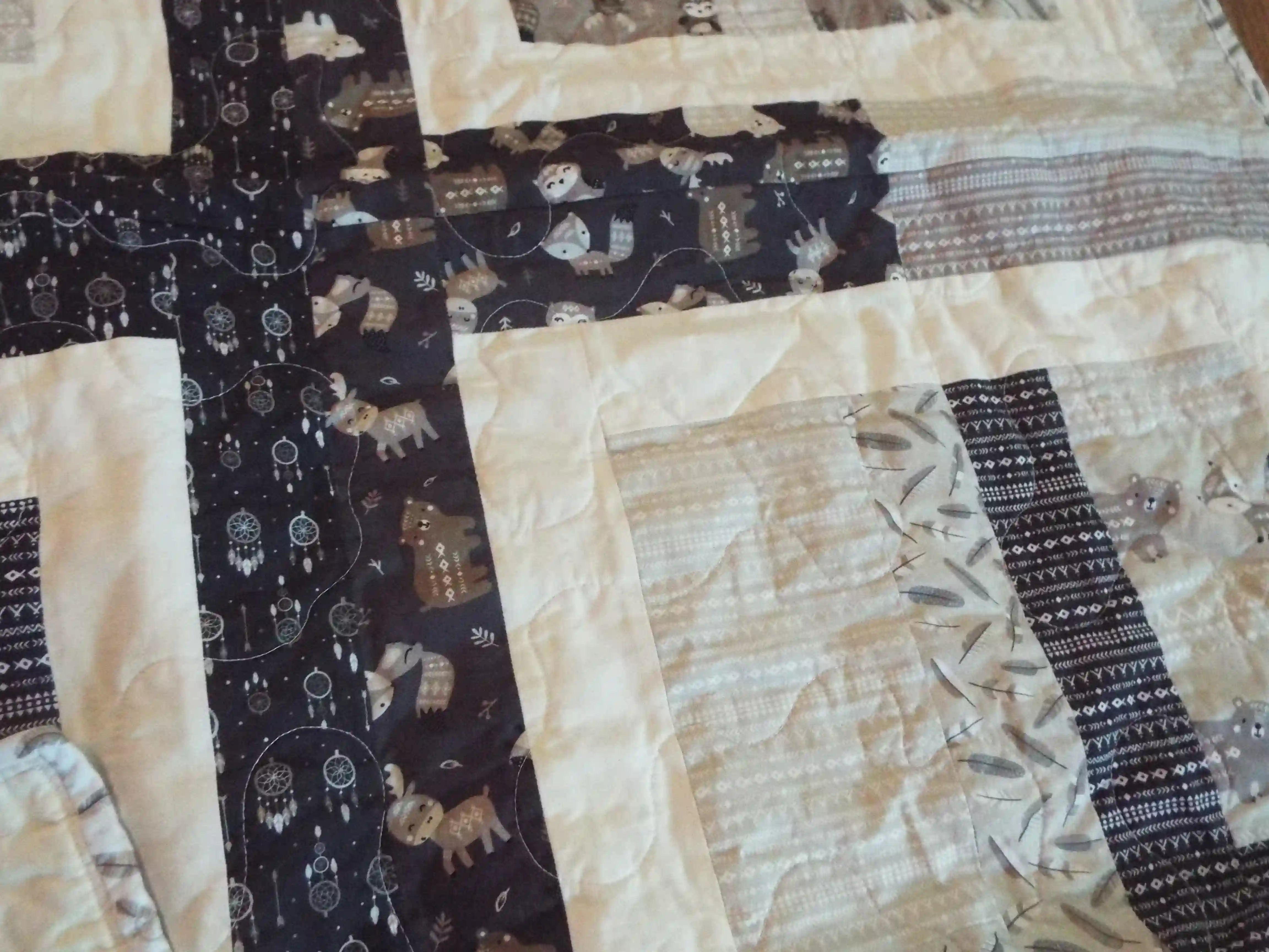 Detail of Little Framework Baby Quilt showing quilt stitching.