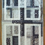 Flat lay of Little Framework Baby Quilt showing entire quilt.