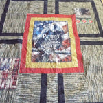 Angled lay of Marine Eagle Handmade Throw Quilt showing closer detail.