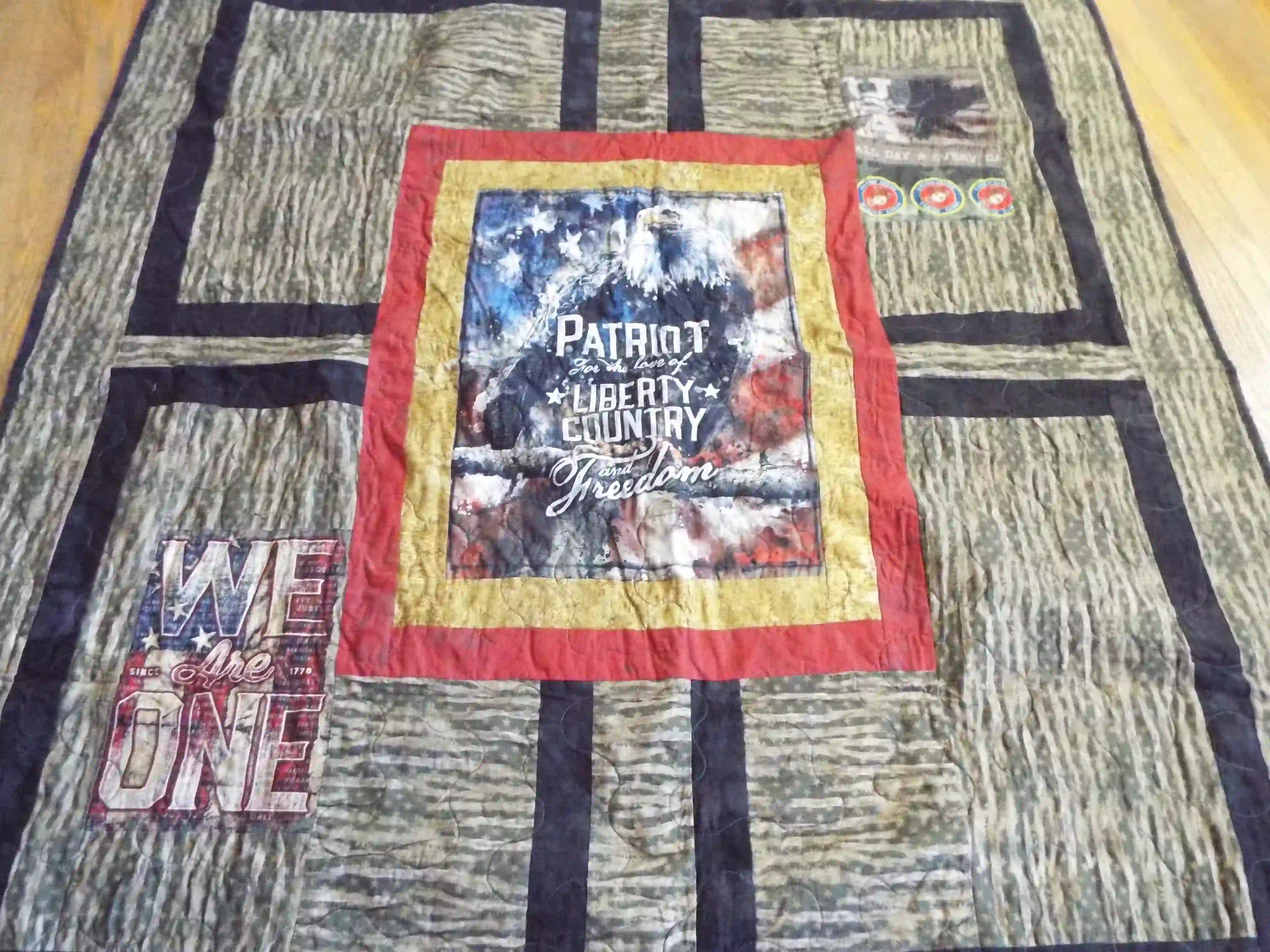 Angled lay of Marine Eagle Handmade Throw Quilt showing closer detail.