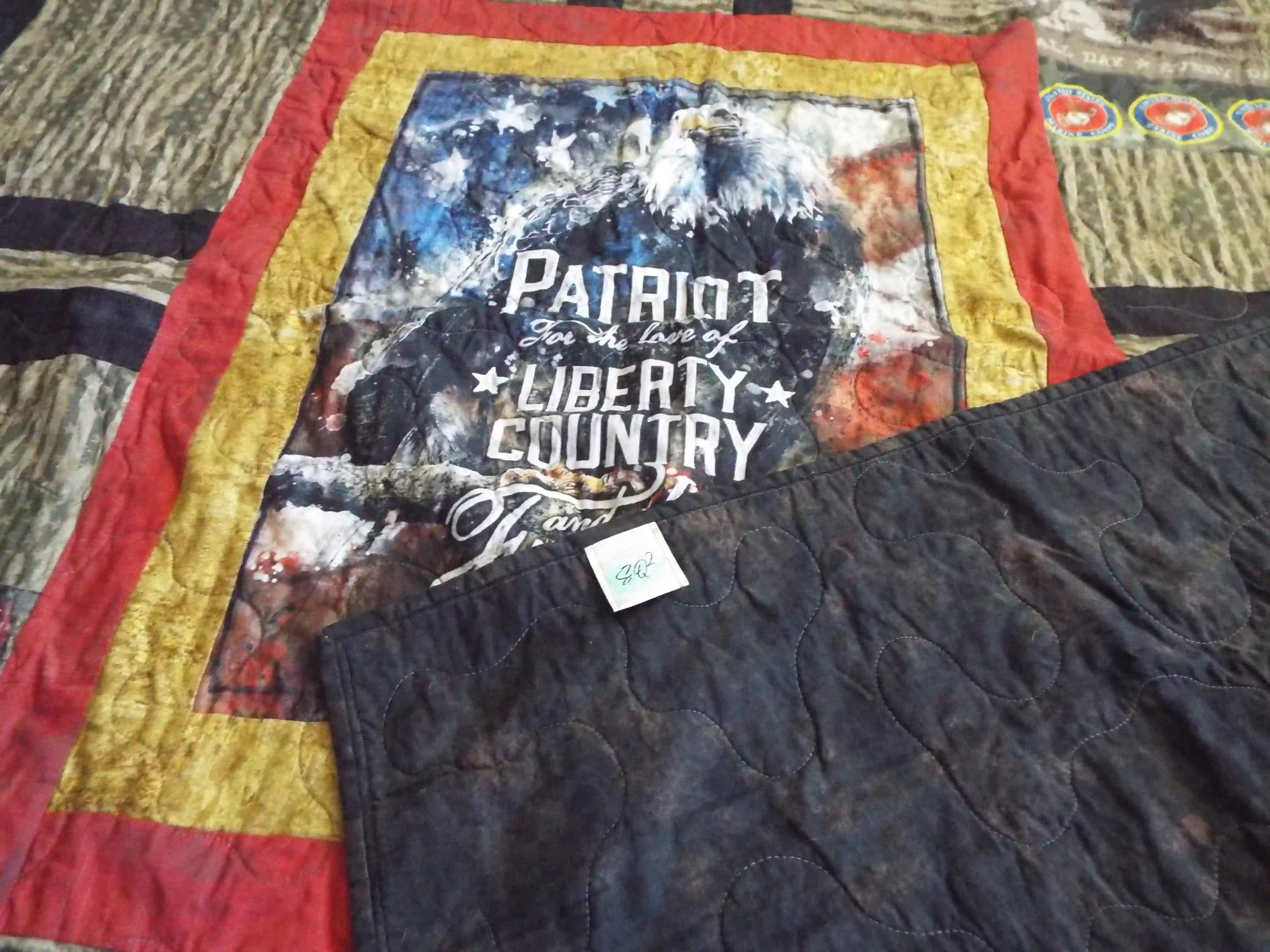 Marine Eagle Handmade Throw Quilt shown with corner flipped over to display backing.