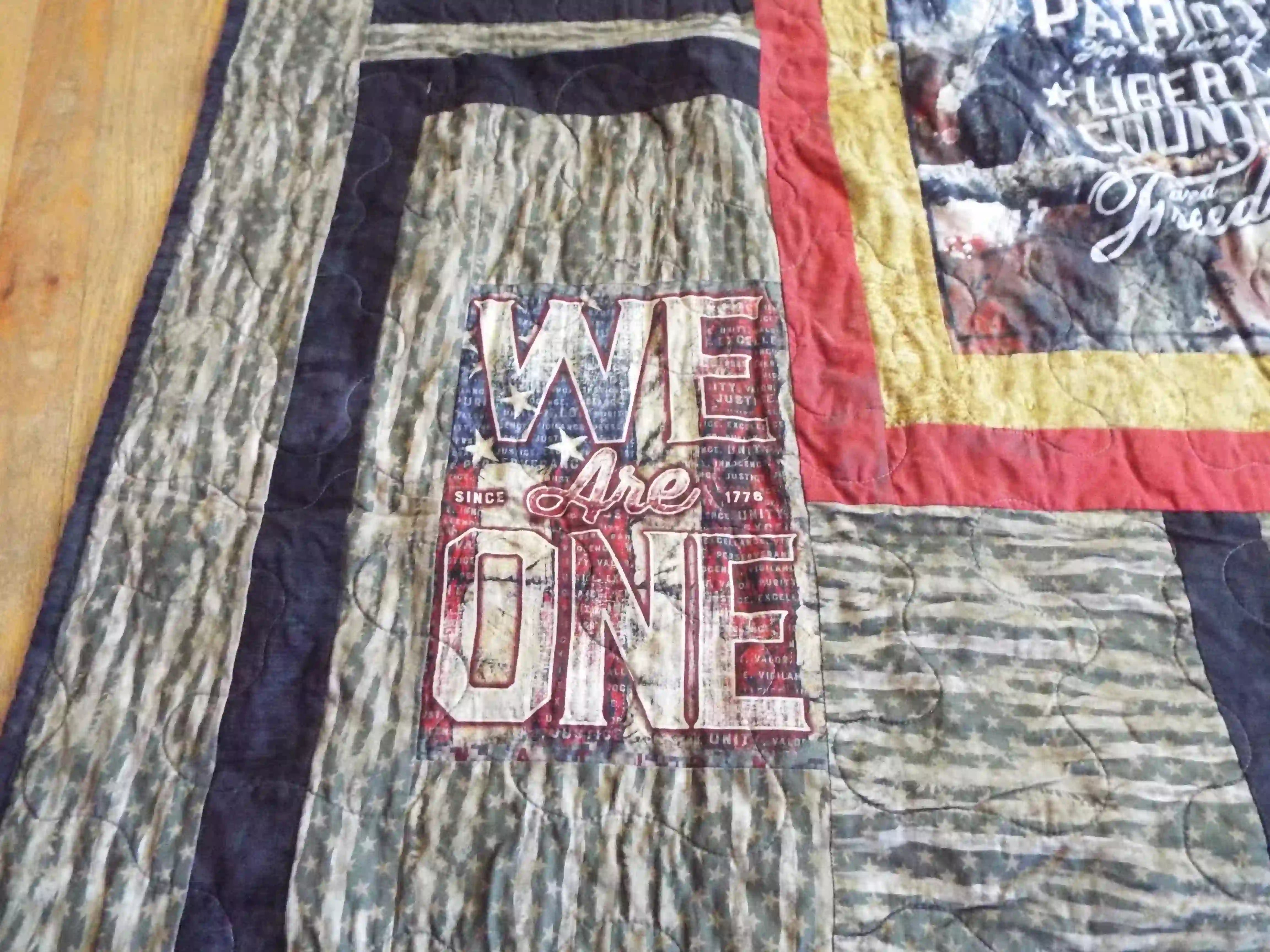 Close up detail of Marine Eagle Handmade Throw Quilt showing stitching detail and close up of smaller panel.