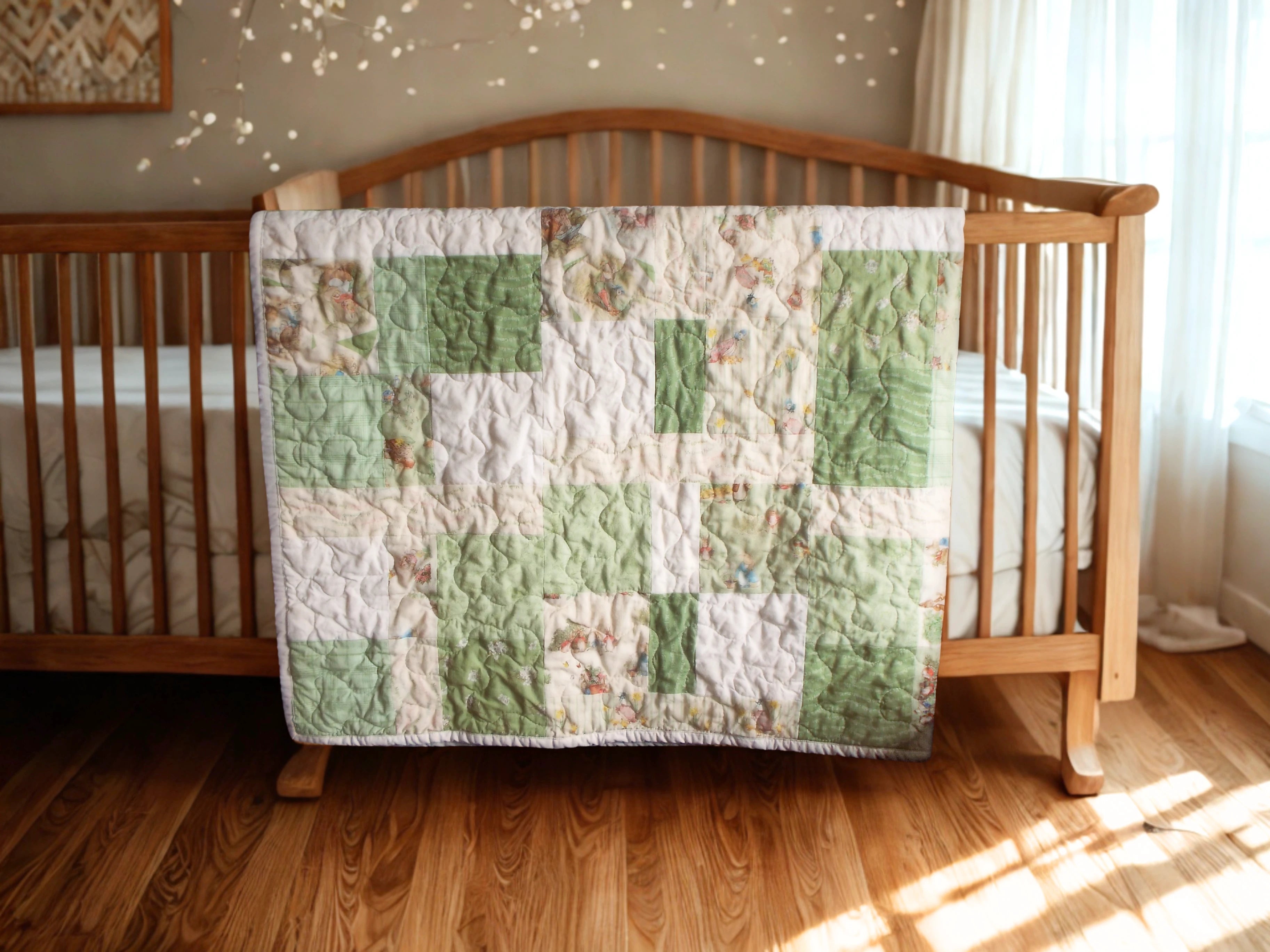 Handmade green baby quilt draped over wooden crib with warm-toned nursery and wood floors