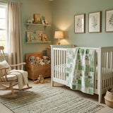 Meadow & Mischief draped over the side of a crib in a sage nursery