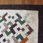 Detail shot of quilt showing border, binding, and stitching detail