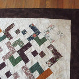 Detail shot of quilt showing border, binding, and stitching detail