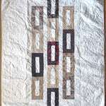 Flay lay of elegant minimal holiday handmade quilt