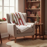 Holiday quilt draped over an armchair in a cozy reading nook