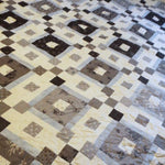 Closer shot of quilt top showcasing fabrics used.