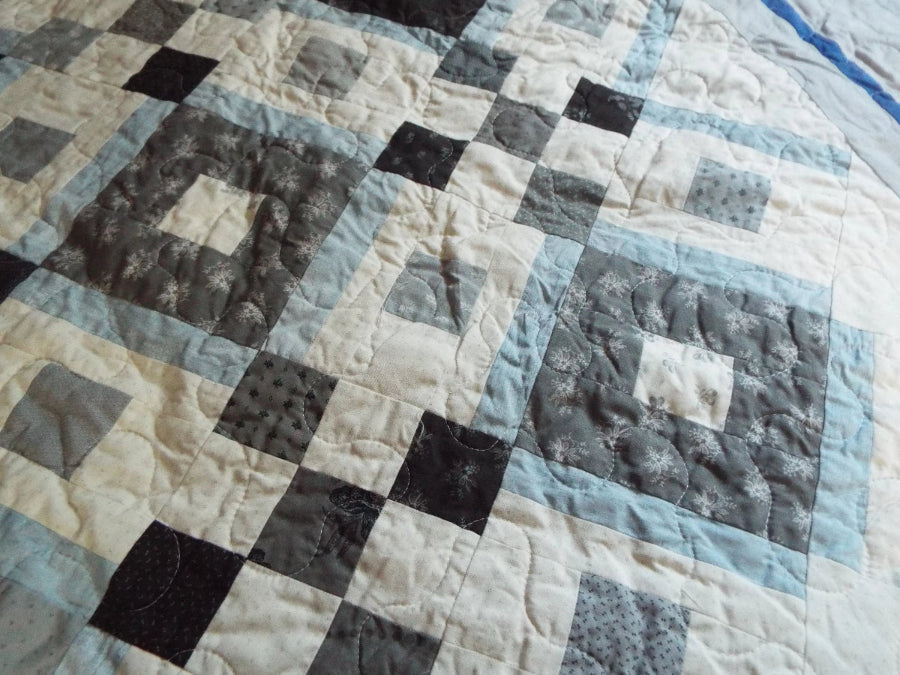 Quilt stitching detail of modern black and white handmade quilt