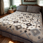 Modern black and white handmade quilt styled in a modern farmhouse bedroom