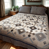 Modern black and white handmade quilt styled in a modern farmhouse bedroom