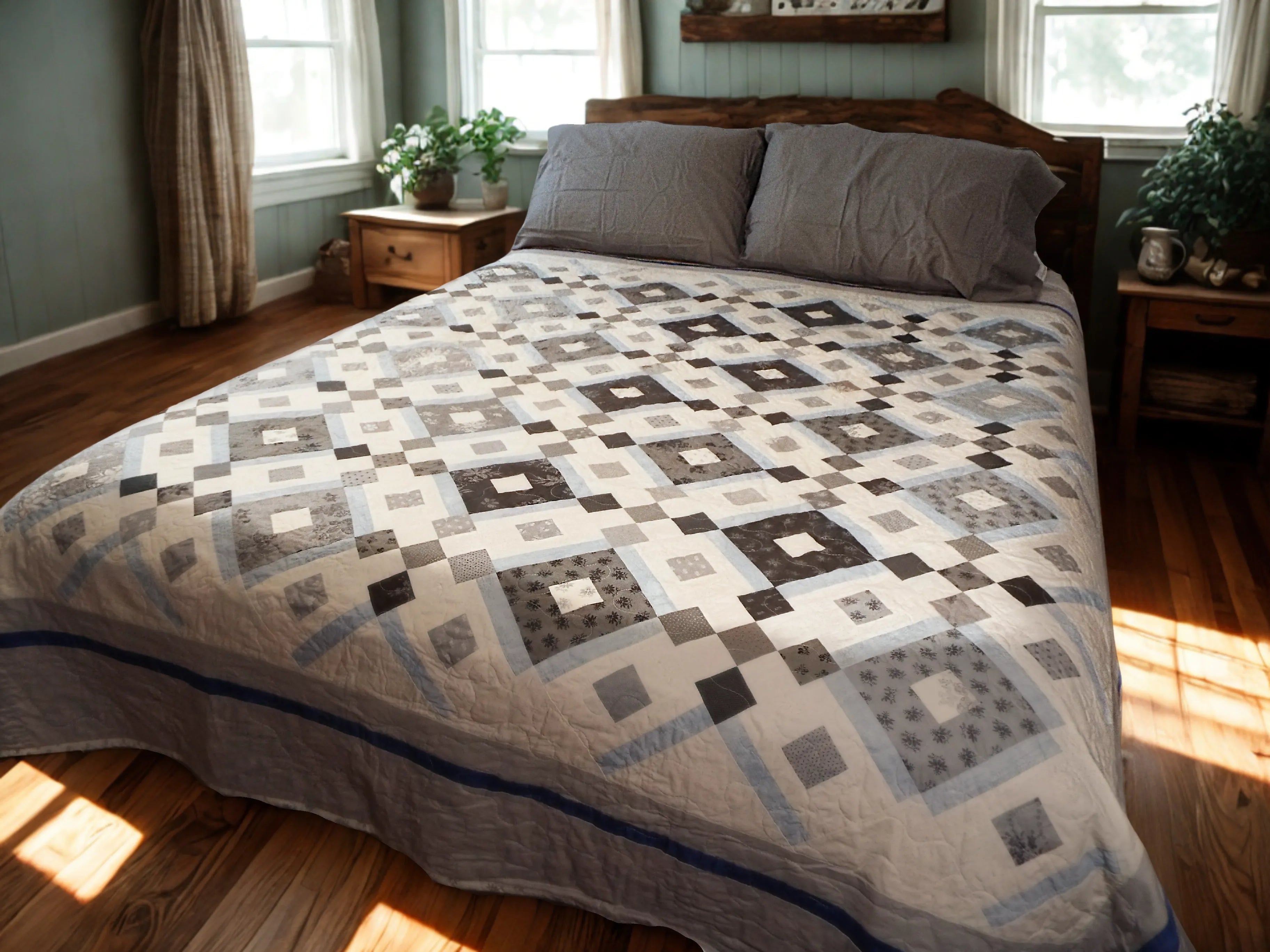 Modern black and white handmade quilt styled in a modern farmhouse bedroom