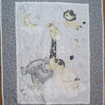 Whole cloth quilt showing animals of the savannah in the clouds getting ready for sleep