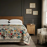 Of Ink & Thread in a modern interior with dark colored walls.