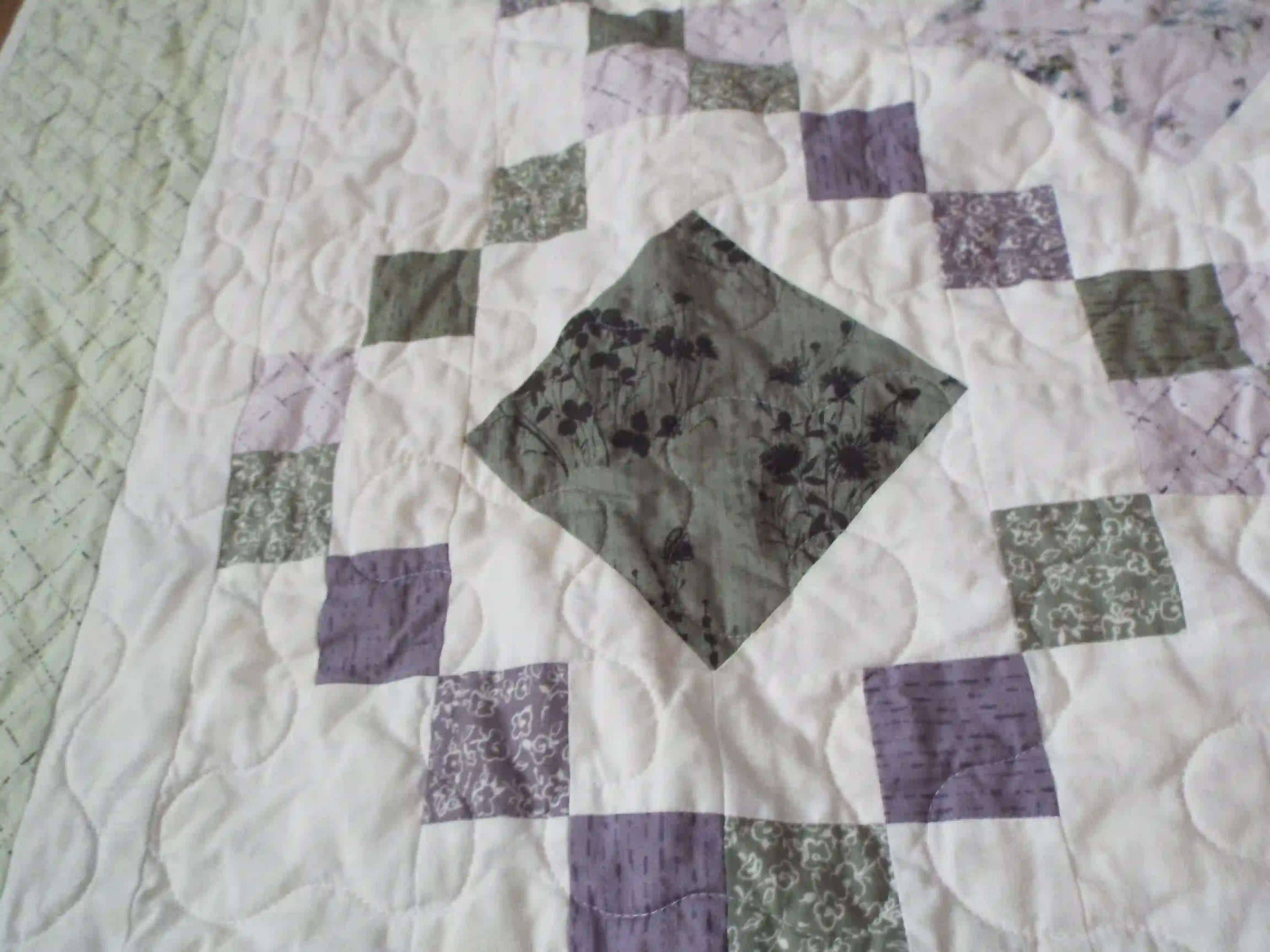 Close up of Quiet Meadow showing fabric and stitching detail.