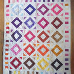 Flat lay of handmade lap quilt showing the entire quilt.